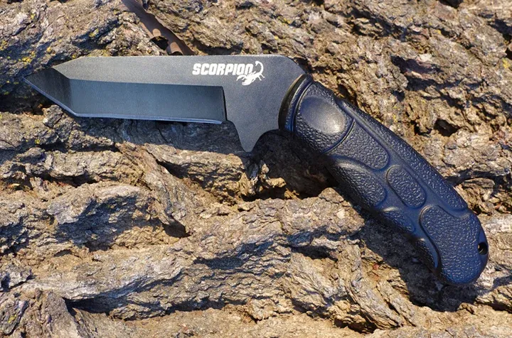 Scorpion fixed blade on rocks